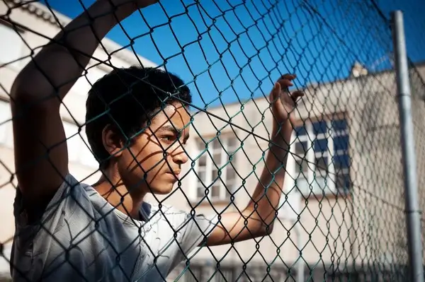 Portrait of a young boy symbolizing children who may have experienced abuse in institutional settings.