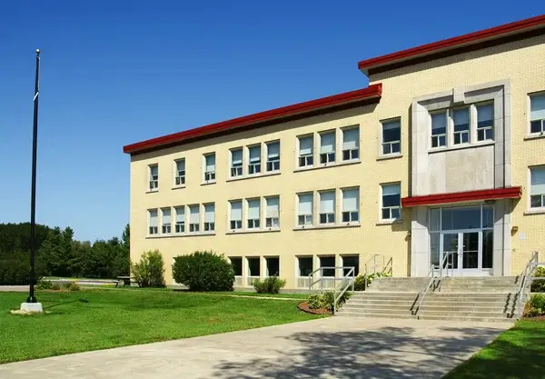 School building entrance representing educational institutions where survivors from Connecticut may have endured abuse.